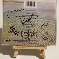 The Cure - Staring At The Sea CD. Signed by Robert Smith, Simon Gallup, Roger O’Donnell, Jason Cooper & Perry Bamonte