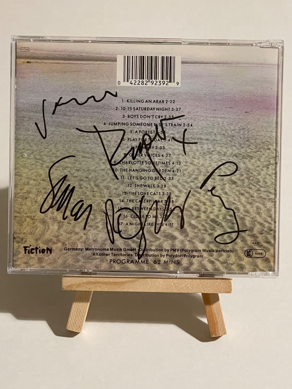 The Cure - Staring At The Sea CD. Signed by Robert Smith, Simon Gallup, Roger O’Donnell, Jason Cooper & Perry Bamonte