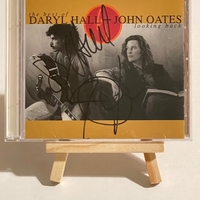 Daryl Hall and John Oates - The Best of Daryl Hall and John Oates Looking Back CD. Signed by Daryl Hall and John Oates