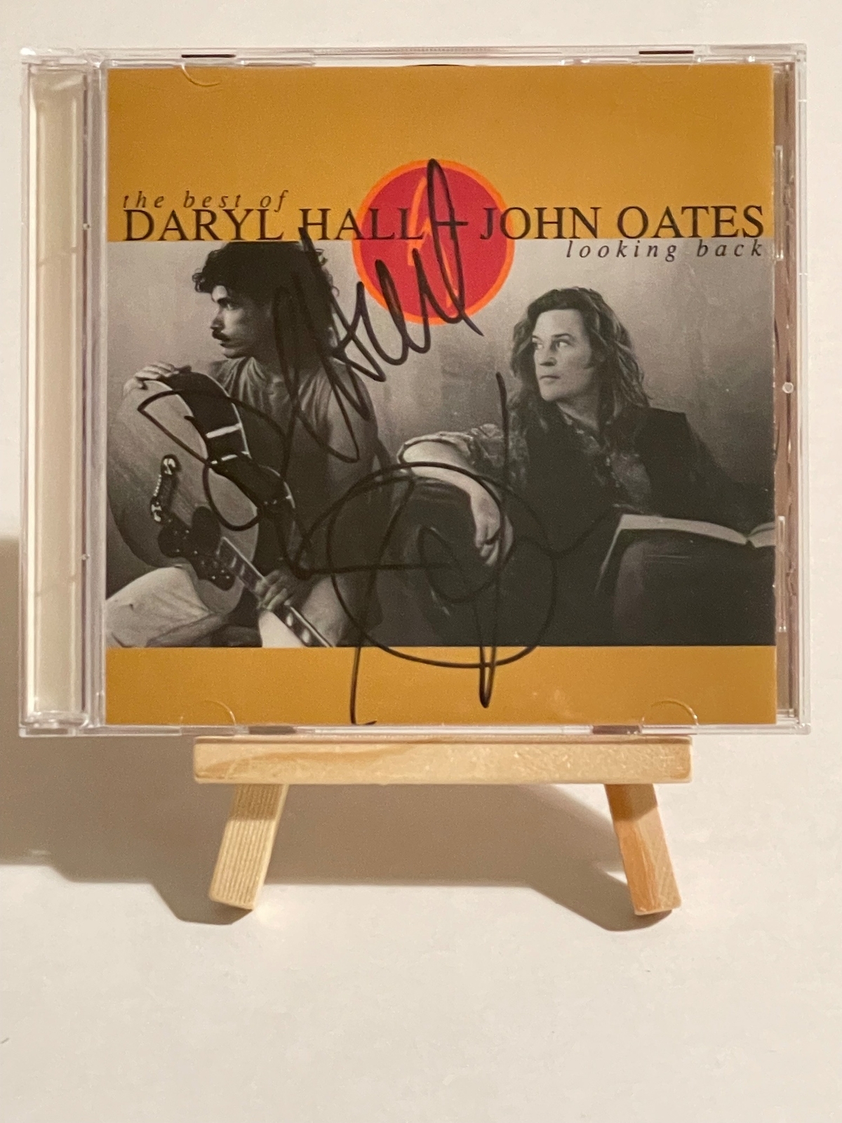 Daryl Hall and John Oates - The Best of Daryl Hall and John Oates Looking Back CD. Signed by Daryl Hall and John Oates