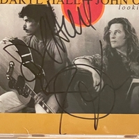 Daryl Hall and John Oates - The Best of Daryl Hall and John Oates Looking Back CD. Signed by Daryl Hall and John Oates