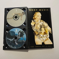 Roxy Music - The Thrill Of It All CD. Signed by Brian Eno, Andy Mackay, Jerry Hall, Paul Thompson, Phil Manzera and Bryan Ferry